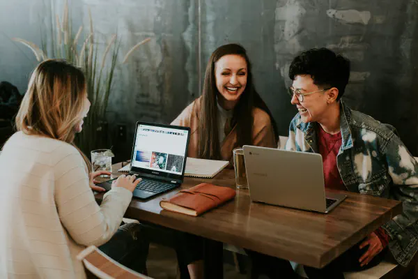 a team of girls working on a website